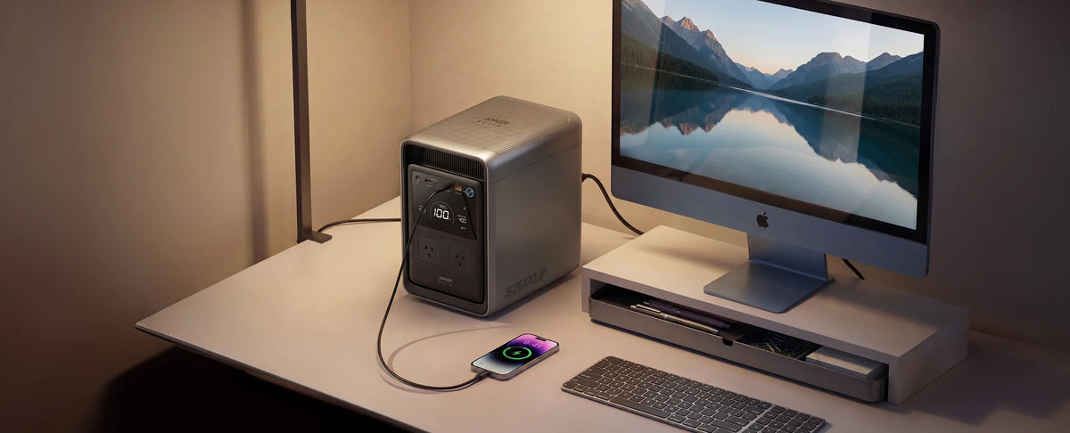Anker SOLIX S2000 providing UPS backup to a desktop computer and phone
